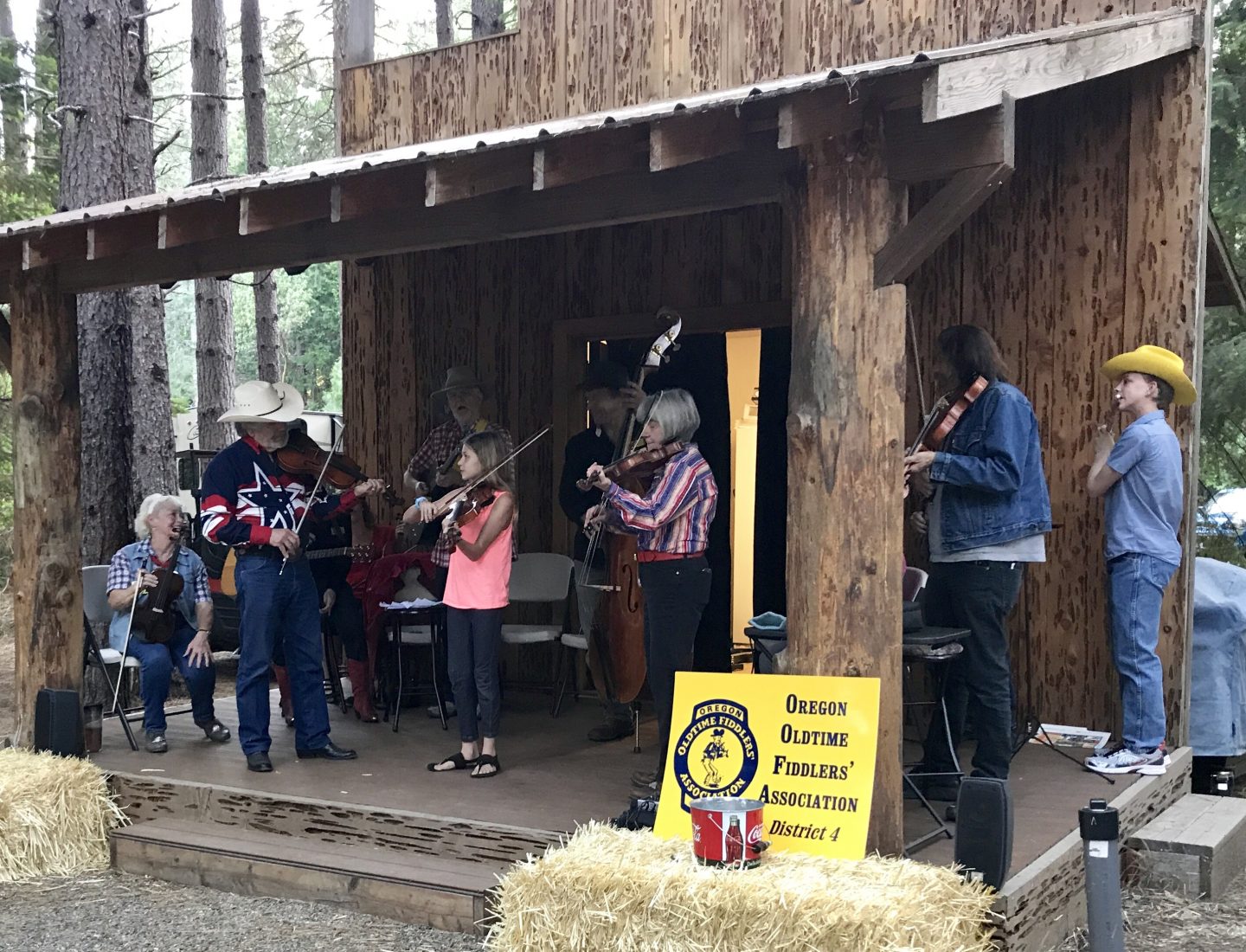 A fiddlers' ensemble performs while campers roast hot dogs and make s'mores during Saturday evening festivities. Our daughter Grace was given the opportunity to showcase a piece she learned at the Fiddle Fest back home.