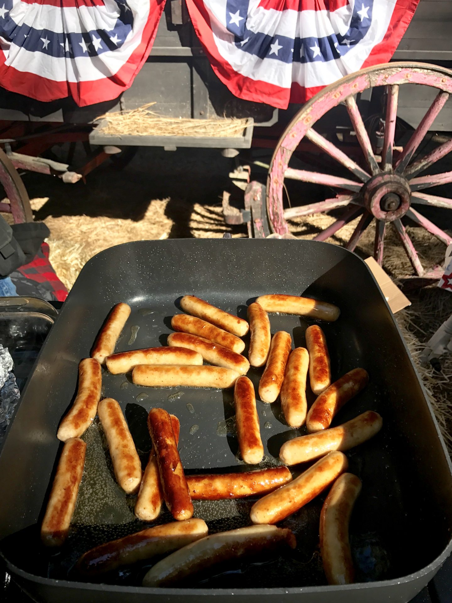 Pancakes, sausage, orange juice, and coffee are provided to campers every Sunday morning in a forest clearing in the center of the campground.